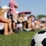 parents-watch-soccer-game-612x300